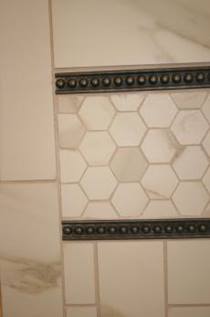 emerson-carpet-one-floor-home-baton-rouge-custom-shower-designs-shower-tub-conversion-marazzi-tile-inlay-close-up